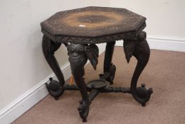 Early 20th century Burmese hardwood octagonal table on elephant head supports, W69cm,