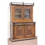 Early 20th century continental oak cabinet, two glazed doors and two drawers above panel doors,