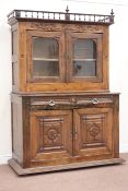 Early 20th century continental oak cabinet, two glazed doors and two drawers above panel doors,