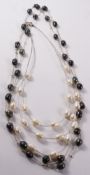 Grey freshwater pearl chain necklace 130cm and a three strand wire white freshwater pearl necklace