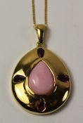 Peach moonstone and rhodolite garnet set pendant on chain stamped 925 Condition Report