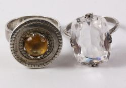 Silver shield shaped ring set with a citrine and a silver ring set with a facetted quartz