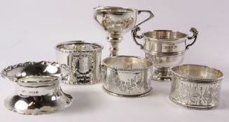 Two small silver trophies and four napkin rings hallmarked approx 4.