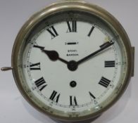 Story of Barrow ship's brass bulk head clock with alloy bezel & white dial with slow/fast lever,