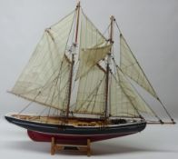 Scale model of the twin masted vessel Bluenose, well detailed & rigged, on stand,