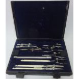 Set of early 20th century Army and Navy drawing instruments in metal case,