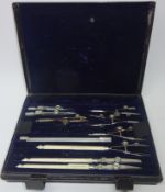 Set of early 20th century Army and Navy drawing instruments in metal case,