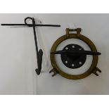 Brass porthole, cast iron cleat and a small anchor,
