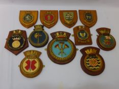 Collection of various ships crest plaques including HMS Battleaxe, Illustrious,