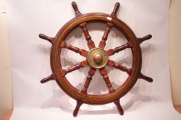 Large brass bound oak eight spoke ship's wheel with brass hub,