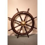 Large brass bound eight spoke ship's wheel with brass hub,