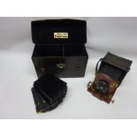 A Thornton Pickard 'Folding Ruby' 1/4 Plate Camera, with black leather covered body,