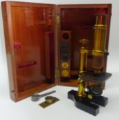 Mid 20th century brass monocular Microscope with three lenses in mahogany case H25cm