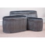 Three galvanized metal oval graduating dolly tub type planters,