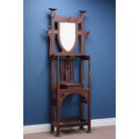 Early 20th century oak Arts & Crafts hall stand, hinged compartment, with shield mirror back,