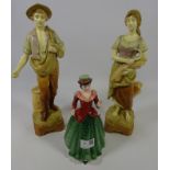 Pair of early 20th Century Amphora type figures and a Royal Doulton figurine 'Holly'