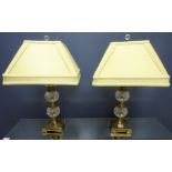 Pair of cut glass and burnished metal table lamps,