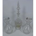 Pair of hand blown glass decanters and an Edwardian etched glass decanter (3) Condition