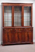 Bradley reproduction mahogany illuminated bookcase enclosed by three bevel glazed doors,