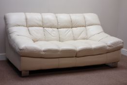 Two seat sofa upholstered in cream cushioned leather,