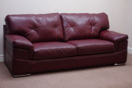 Large two seat sofa upholstered in burgundy leather,