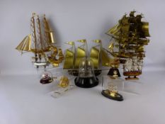 Collection of nine metal model ships, five glass ships in bottles,