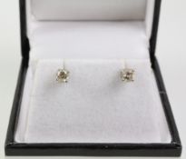 Pair of diamond ear-studs hallmarked 18ct Condition Report <a href='//www.