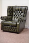 Saxon traditional wingback armchair upholstered in green studded leather,