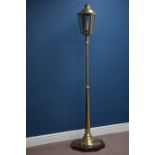 Early 20th century brass and glazed lantern on stand, on oak octagonal platform,