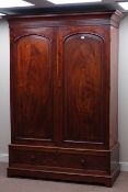 Early 19th century figured mahogany wardrobe, two arched panelled doors, hanging space interior,