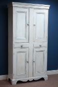 Painted pine kitchen cupboard, enclosed by four panelled doors, with two drawers, shaped plinth,
