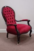 Victorian style stained beech armchair upholstered in buttoned red fabric Condition