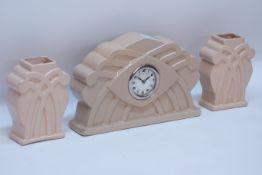 Art Deco period beige ceramic three piece clock garniture,