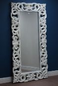 Large rectangular Florentine style wall mirror in distressed white painted ornate frame,