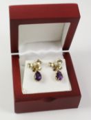 Pair of amethyst and seed pearl silver-gilt bow ear-rings stamped 925 Condition Report