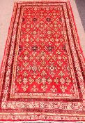 Persian Arak red ground rug, 325cm x 170cm Condition Report <a href='//www.