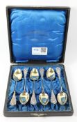 Set of six early 20th century German silver teaspoons, gilt bowls retailed by Bernh.