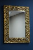 Two early 20th century embossed brass framed mirrors with bevelled glass Condition