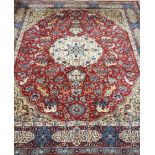 Large Persian design rug carpet, deep red ground, decorated with animals and floral patterns,
