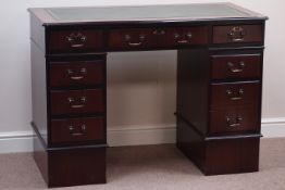 Reproduction mahogany serpentine twin pedestal desk with leather inset top,