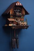 Black Forest style cuckoo clock with moving beer drinkers and mill wheel,