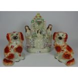 Pair of Victorian Staffordshire Spaniels and a Staffordshire flat back pocket watch holder (3)