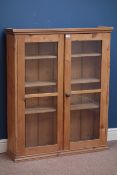 19th century pine bookcase enclosed by two glazed doors, W91cm, H112cm,