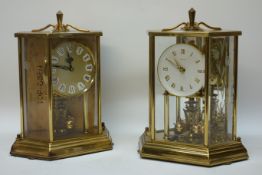 Two 'Kundo' glazed anniversary clocks CLOCKS & BAROMETERS - as we are not a retailer,