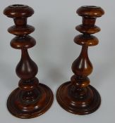 Edwardian oak plant stand and a pair of Edwardian yew wood candlesticks (3) Condition