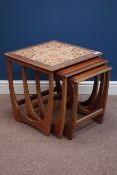 G-Plan teak nest three 'Astro' tables, one with tiled top,