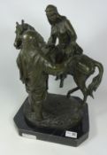 Cast bronze sculpture of Arabic figure dismounting horse on marble plinth,