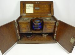 Early 20th Century oak smokers cabinet with ceramics tobacco jar,