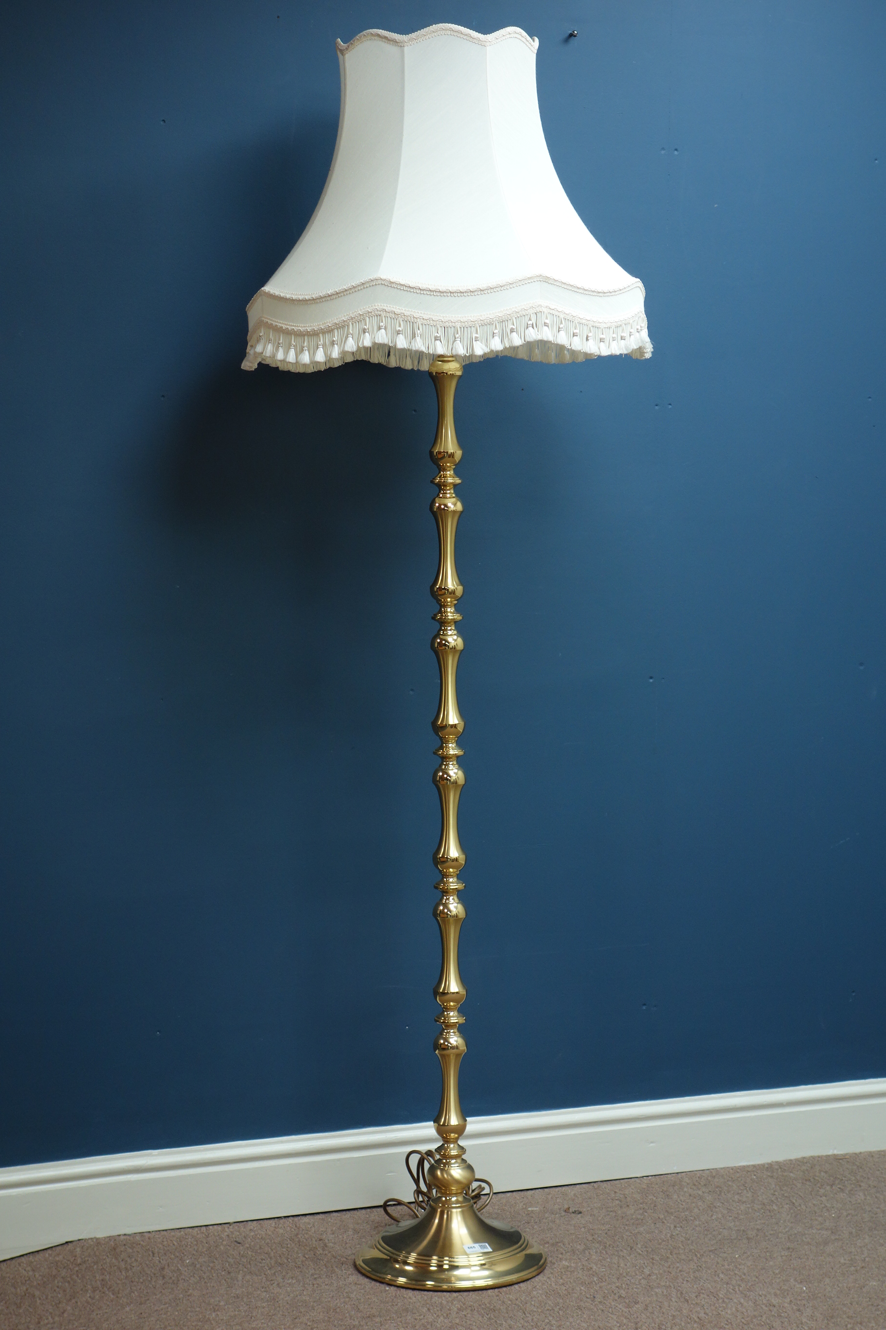 Brass standard lamp with shade,