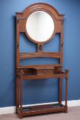 Early 20th century oak hall stand with circular bevelled mirror and drawer, W94cm, H202cm,
